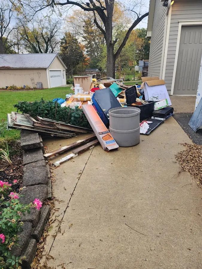 Dumpster being loaded with debris for Residential Dumpster Rental in Ellensburg